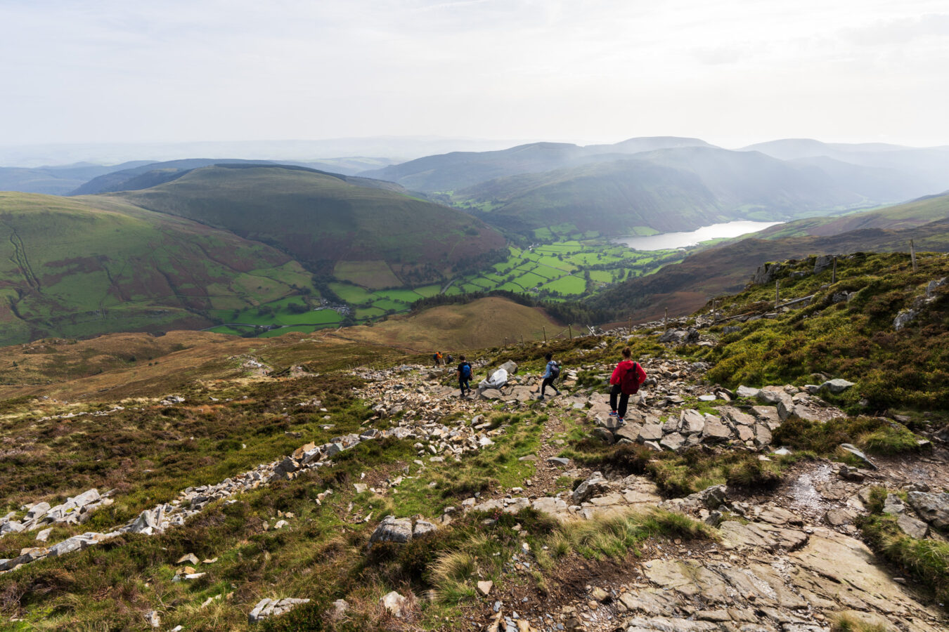 Walking down the steep route, with Talyllyn lake in the background.