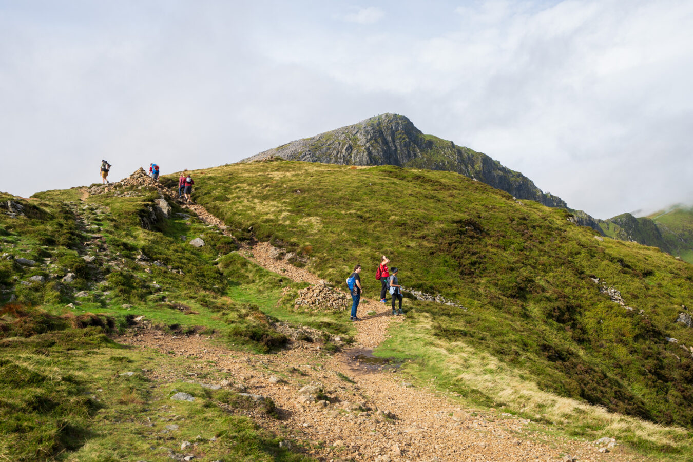 Hikers walking towards the top