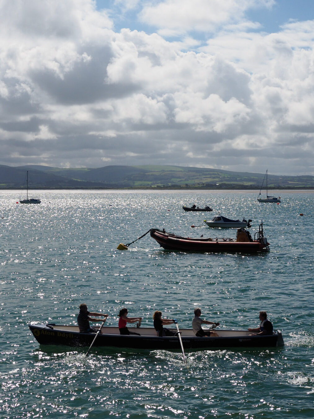 Rowing boat and other boats in the background