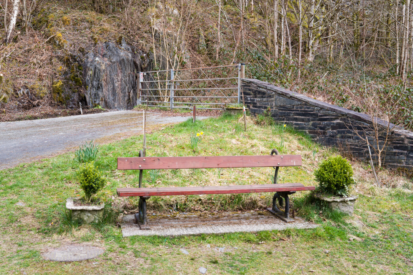 Bench with large gate behind