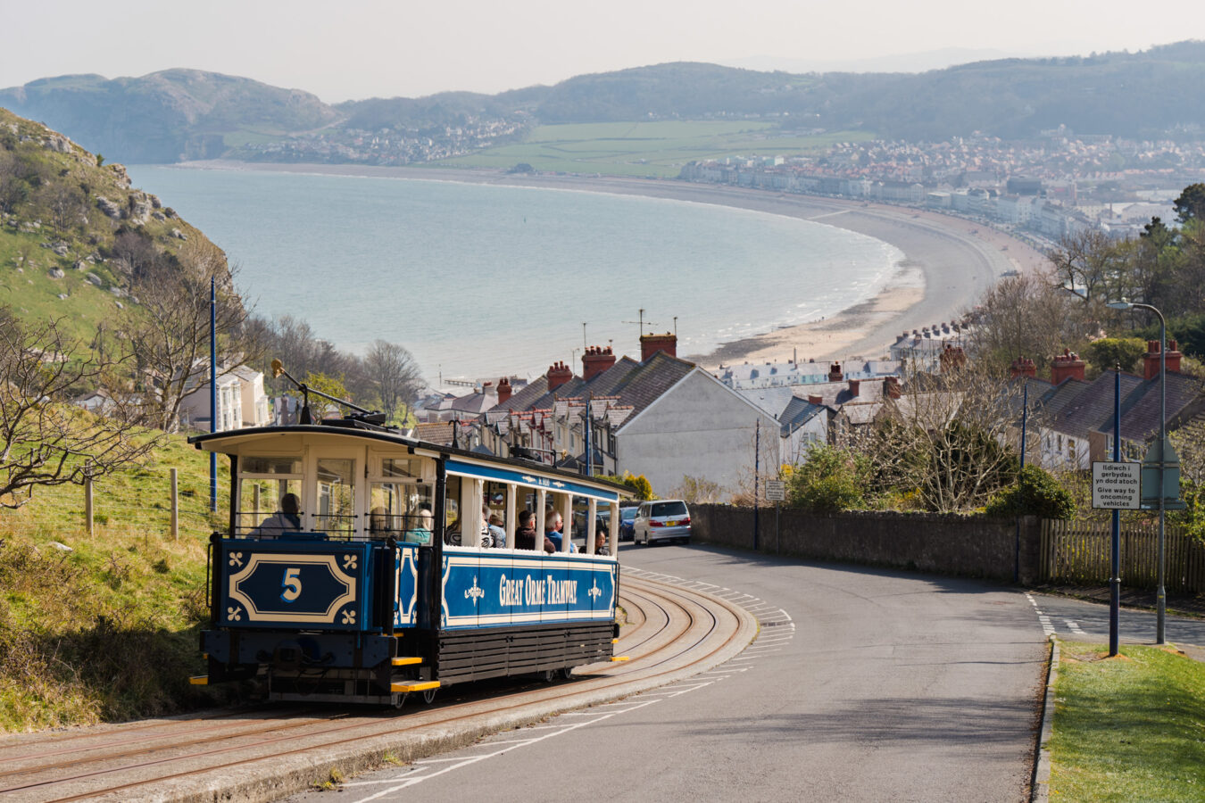 Great Orme Tramway climbing the hill with Llandudno bay in the background.