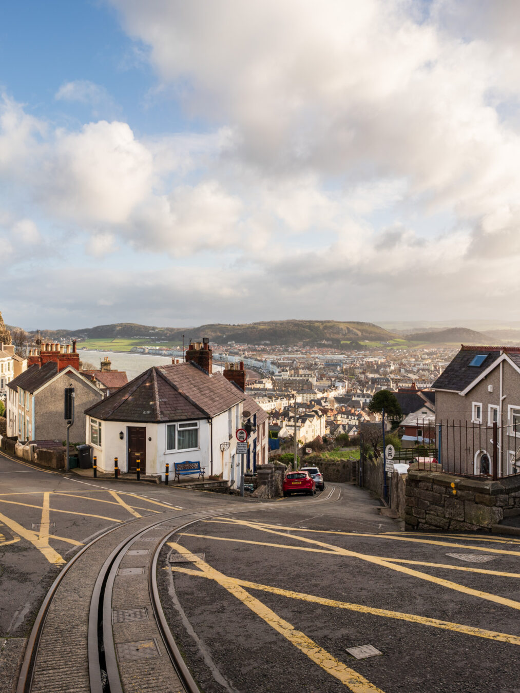 Hill road and intersection with Llandudno in the background
