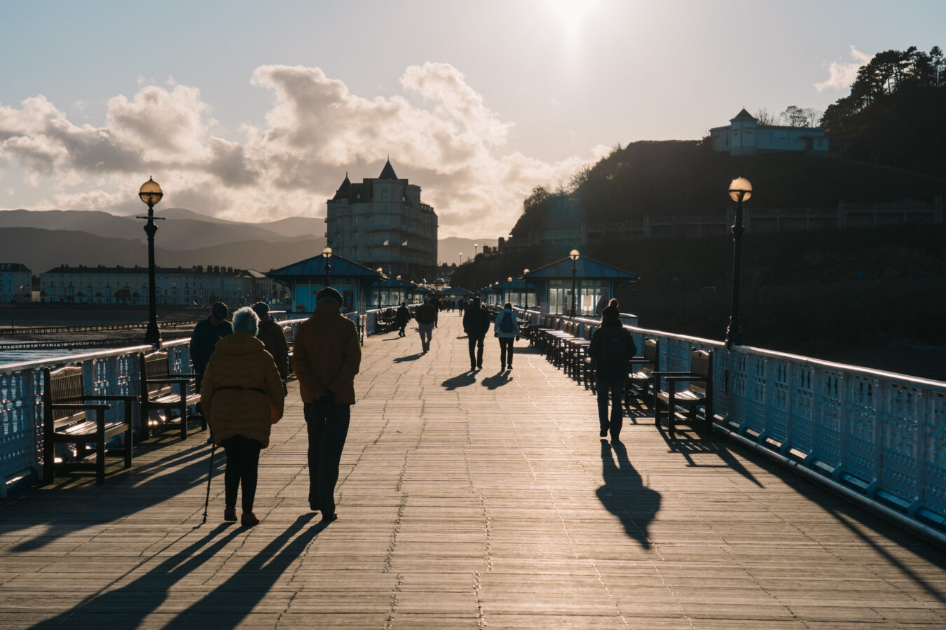People walking on the pier near sunset time