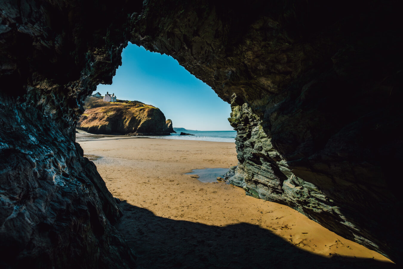 Cave view from inside with beach in the background