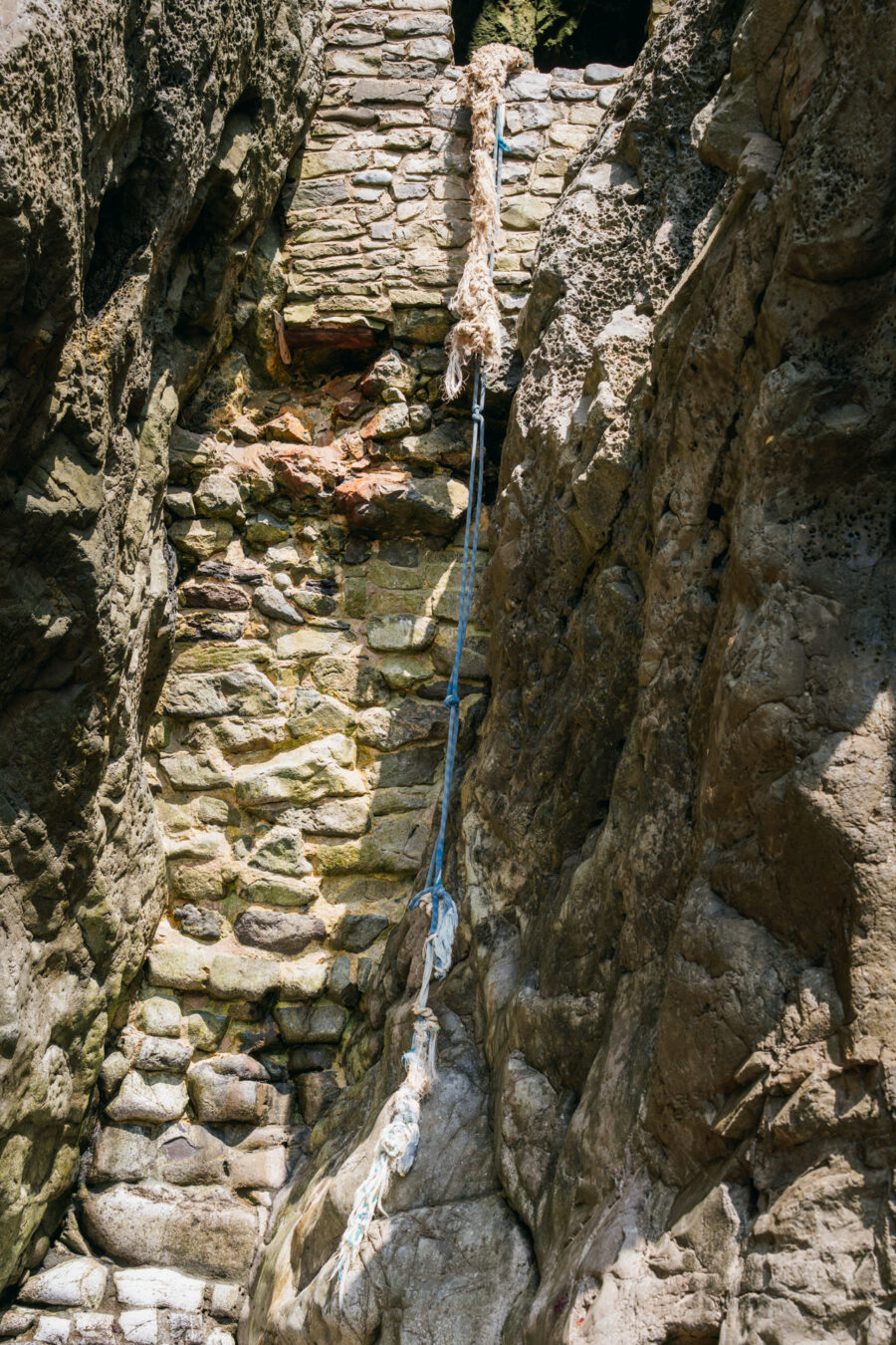 Blue rope hanging from first opening