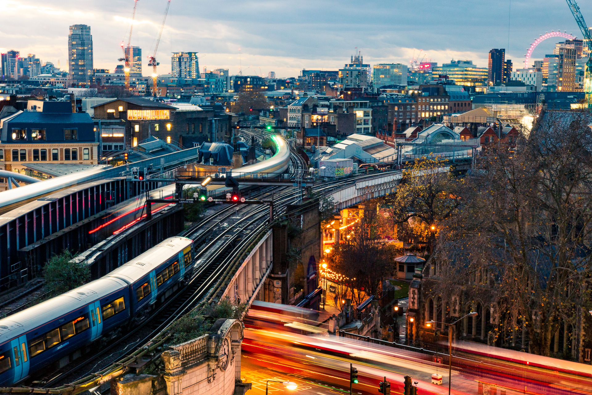 A high angle shot of modern buildings at dark night in London, England