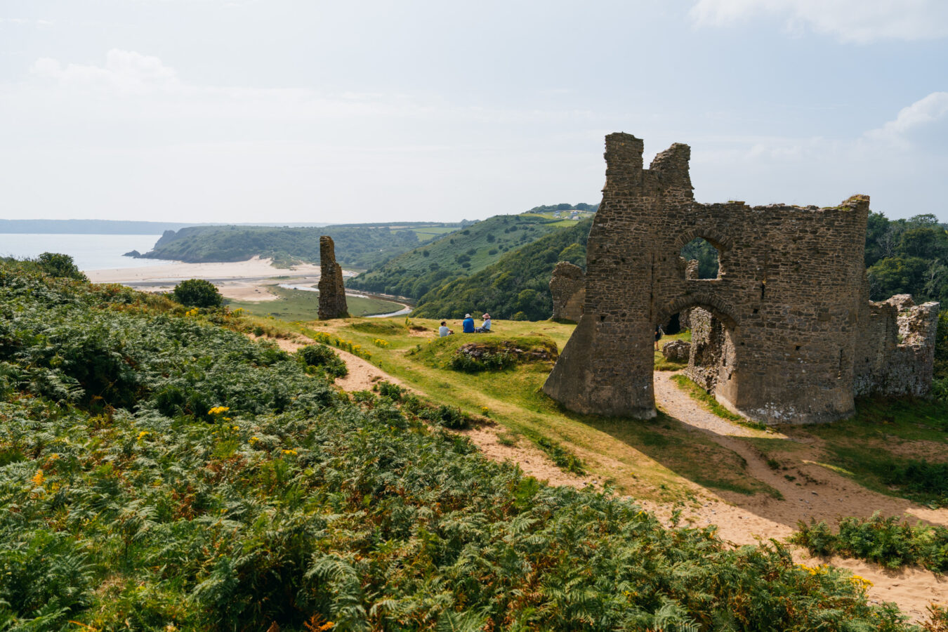 Pennard Castle with bay in the background