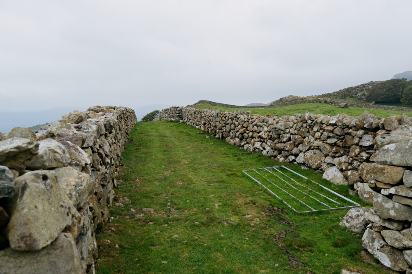 Corridor through stone walls