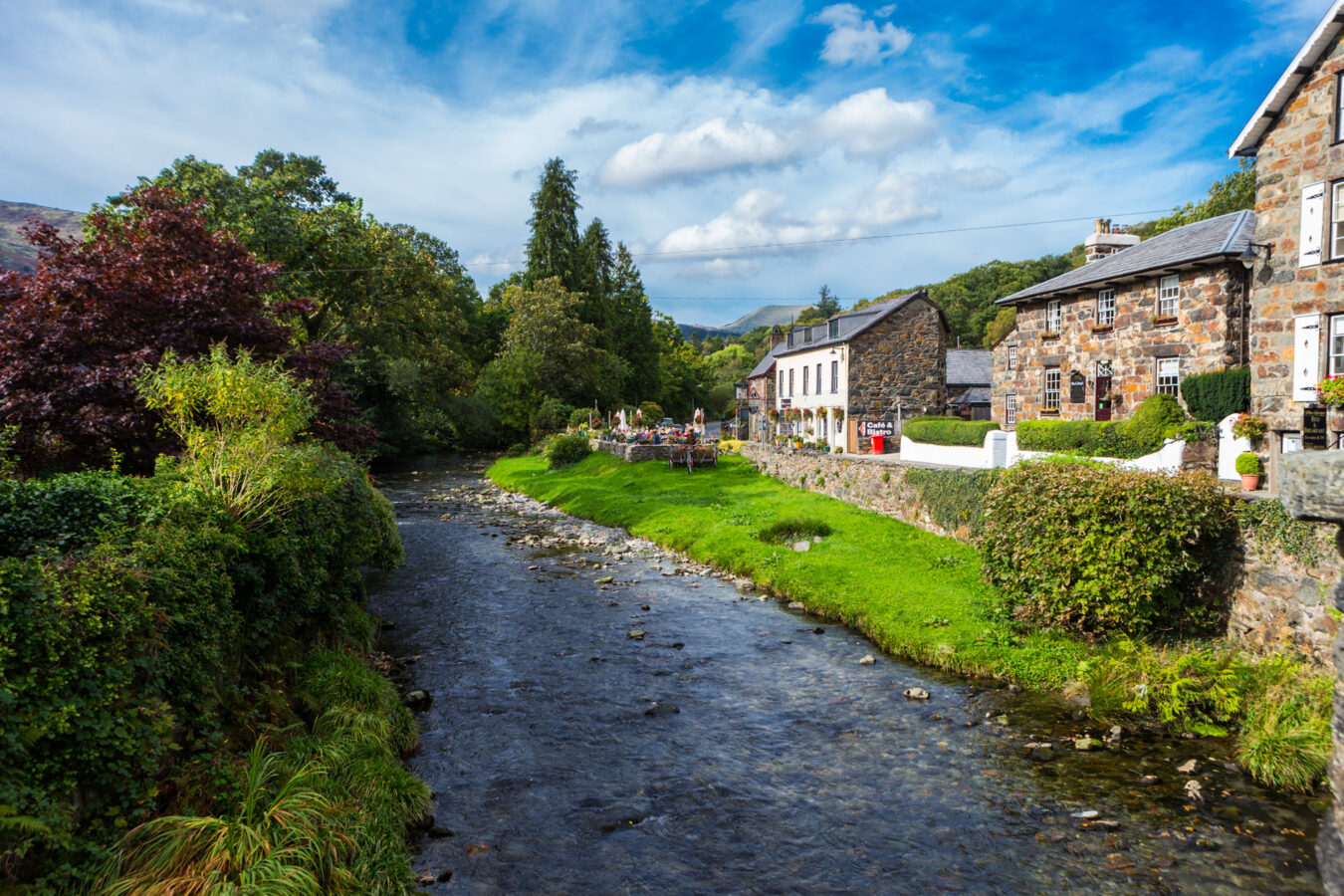 River, trees and cottages in a sunny day in Beddgelert