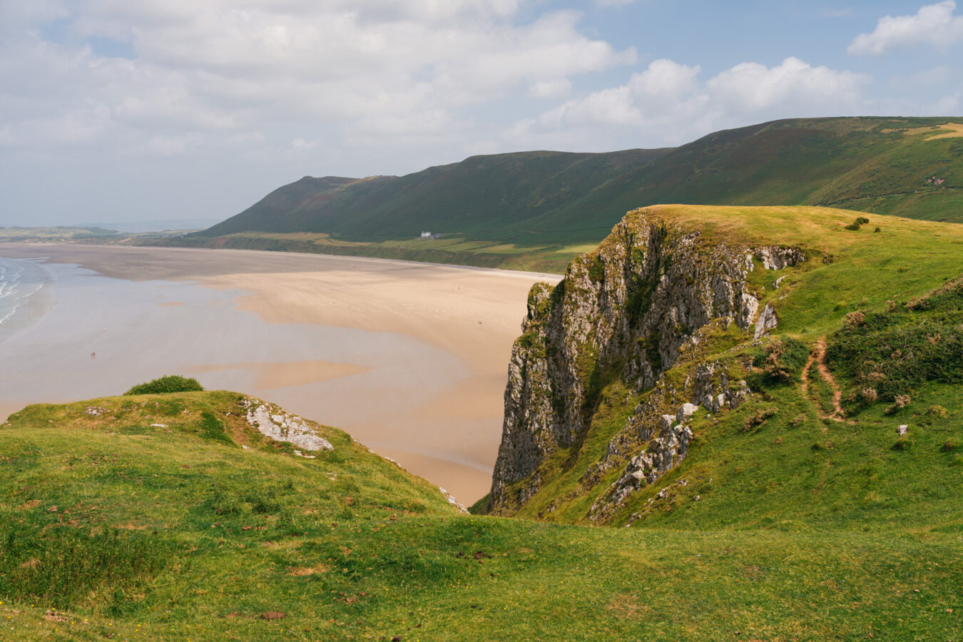 Rhossili bay with beach and dramatic cliffs