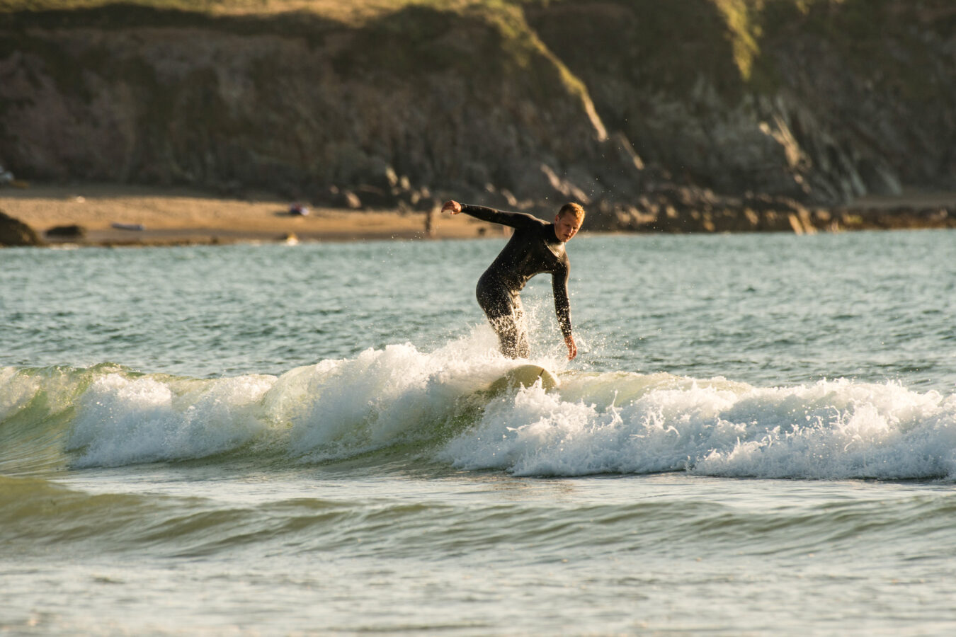 Man surfing at Whitesands Bay