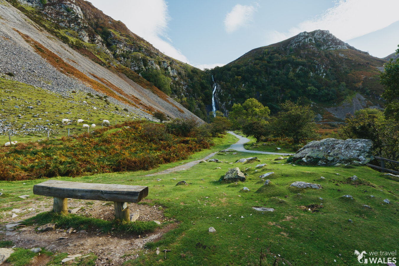 Aber Falls in the distance, with bench on the foreground