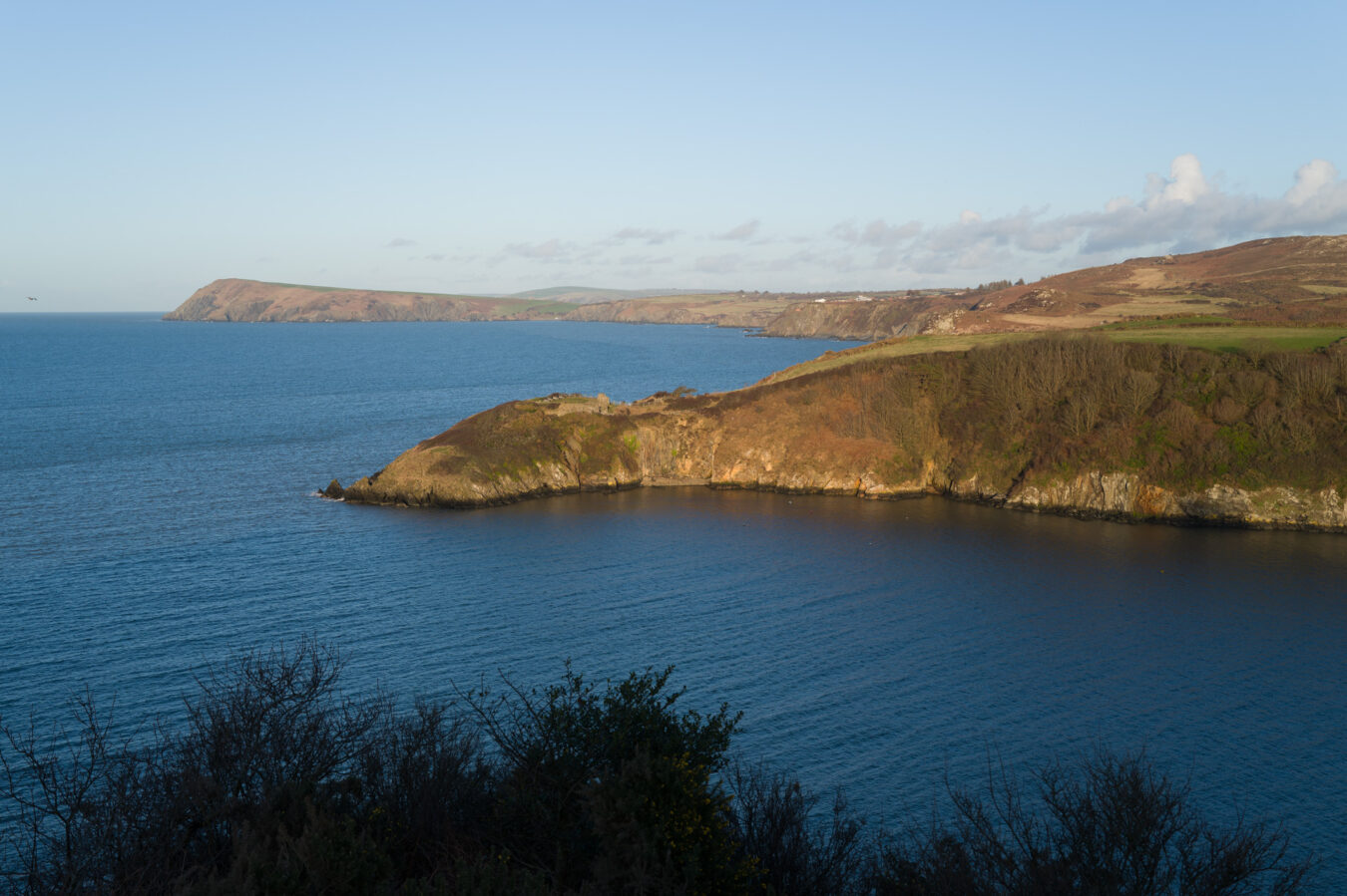 View of the coastline with Fishguard Fort in the distance
