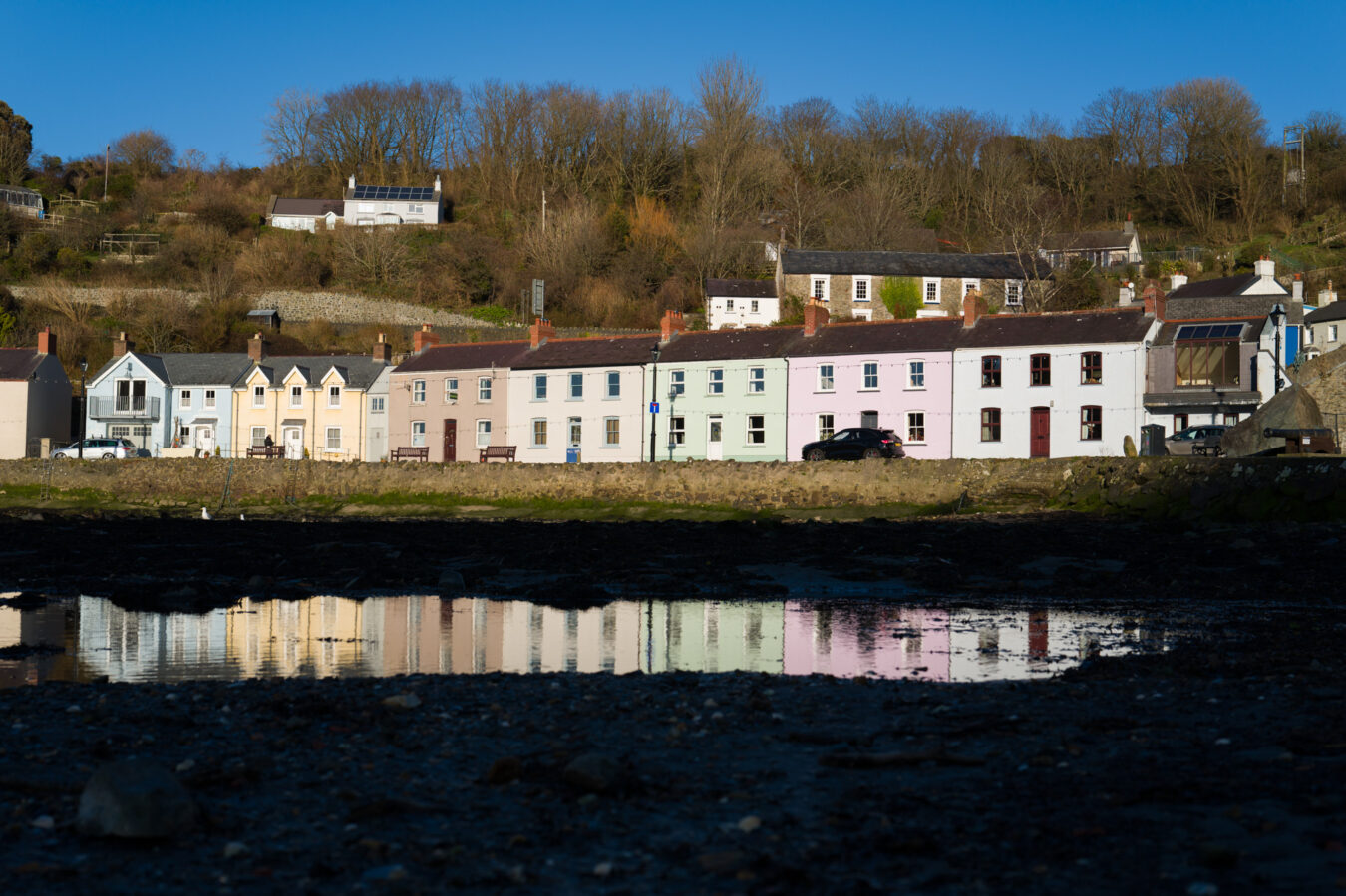 Coloured cottages reflected in the water