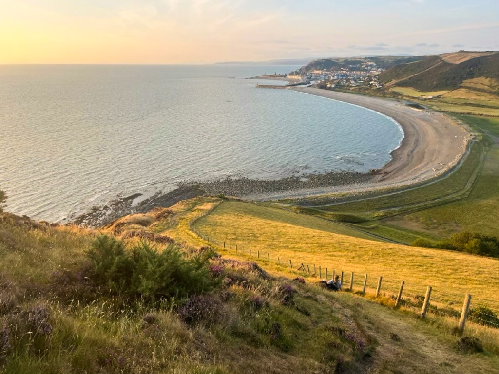 Coastline with Aberystwyth in the distance, near sunset