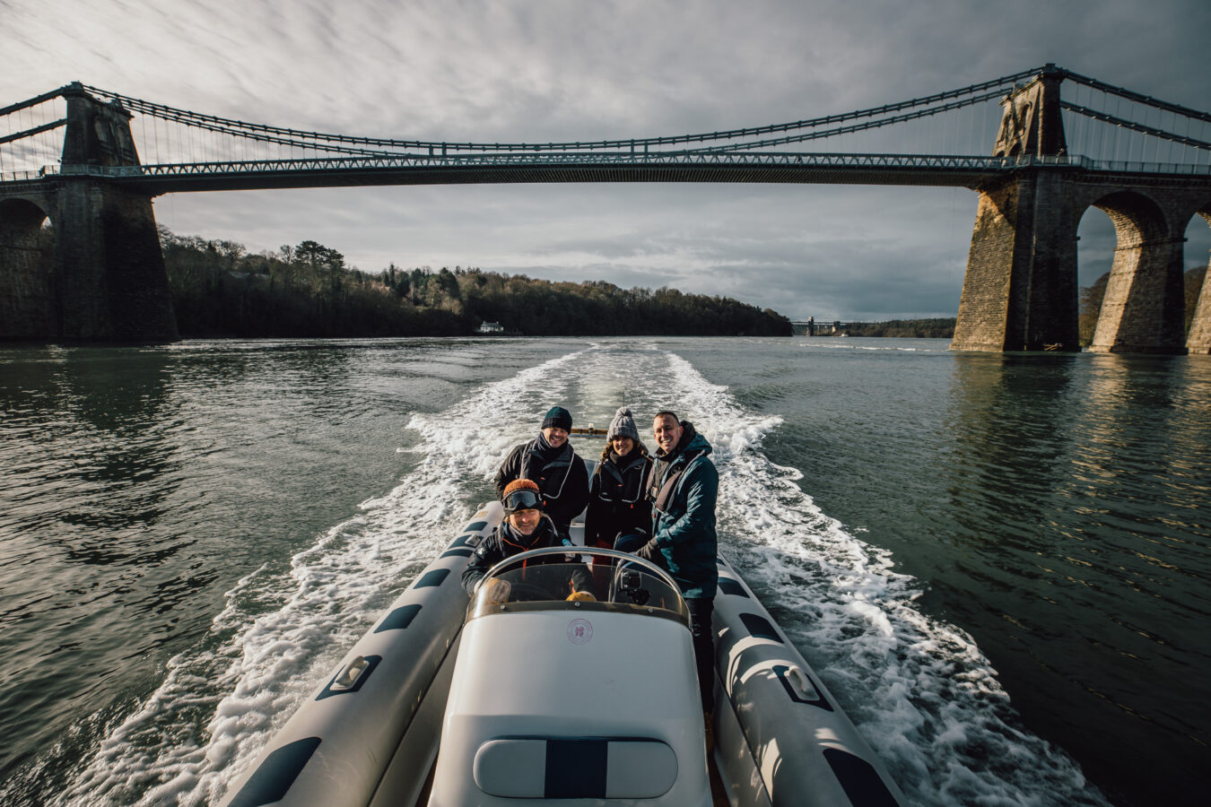 Boat tour on the Menai Strait with Menai Bridge in the background